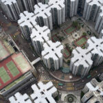 An aerial photograph of apartment blocks in a dense city.